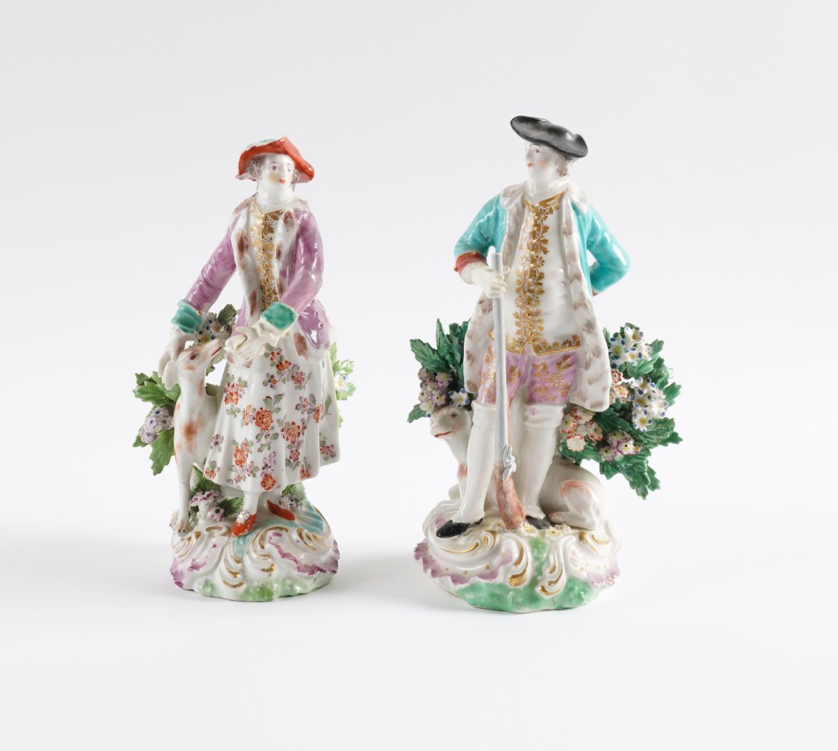 Appraisal: A MATCHED PAIR OF DERBY FIGURES OF A HUNTSMAN AND