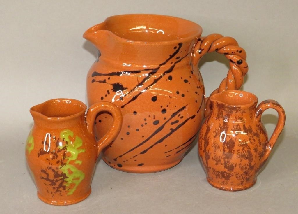 Appraisal: PIECES OF BREININGER REPRODUCTION REDWAREca all wheel thrown bulbous pitchers