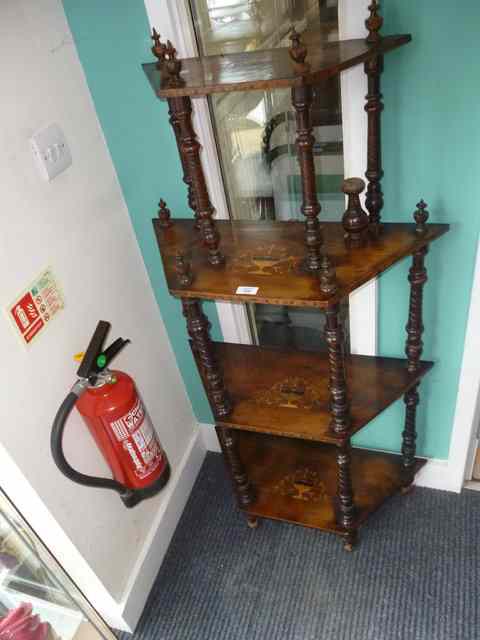 Appraisal: A VICTORIAN WALNUT FOUR TIER WHATNOT with marquetry inlay and