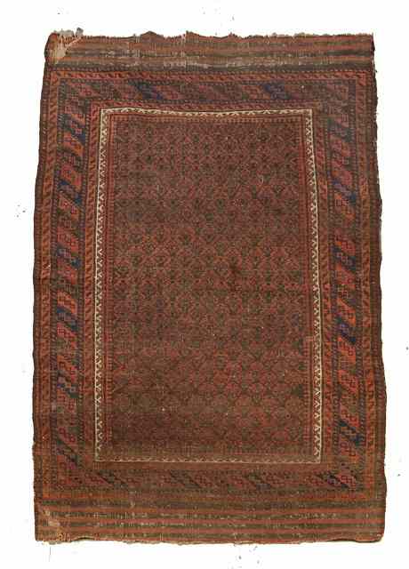 Appraisal: AN OLD BELOUCH RUG with geometric decoration and with banded