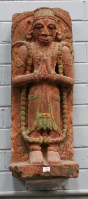 Appraisal: A carved red sandstone figure of Hanuman with traces of