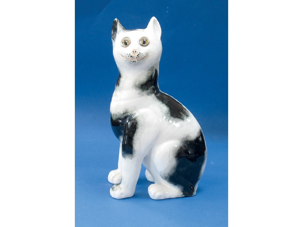 Appraisal: A WEMYSS POTTERY MODEL OF A SEATED CAT with sponged