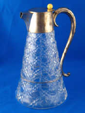 Appraisal: A silver mounted hobnail cut glass claret jug with scroll