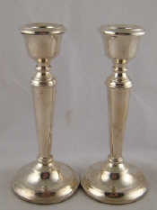 Appraisal: A pair of silver candlesticks Mappin and Webb with the