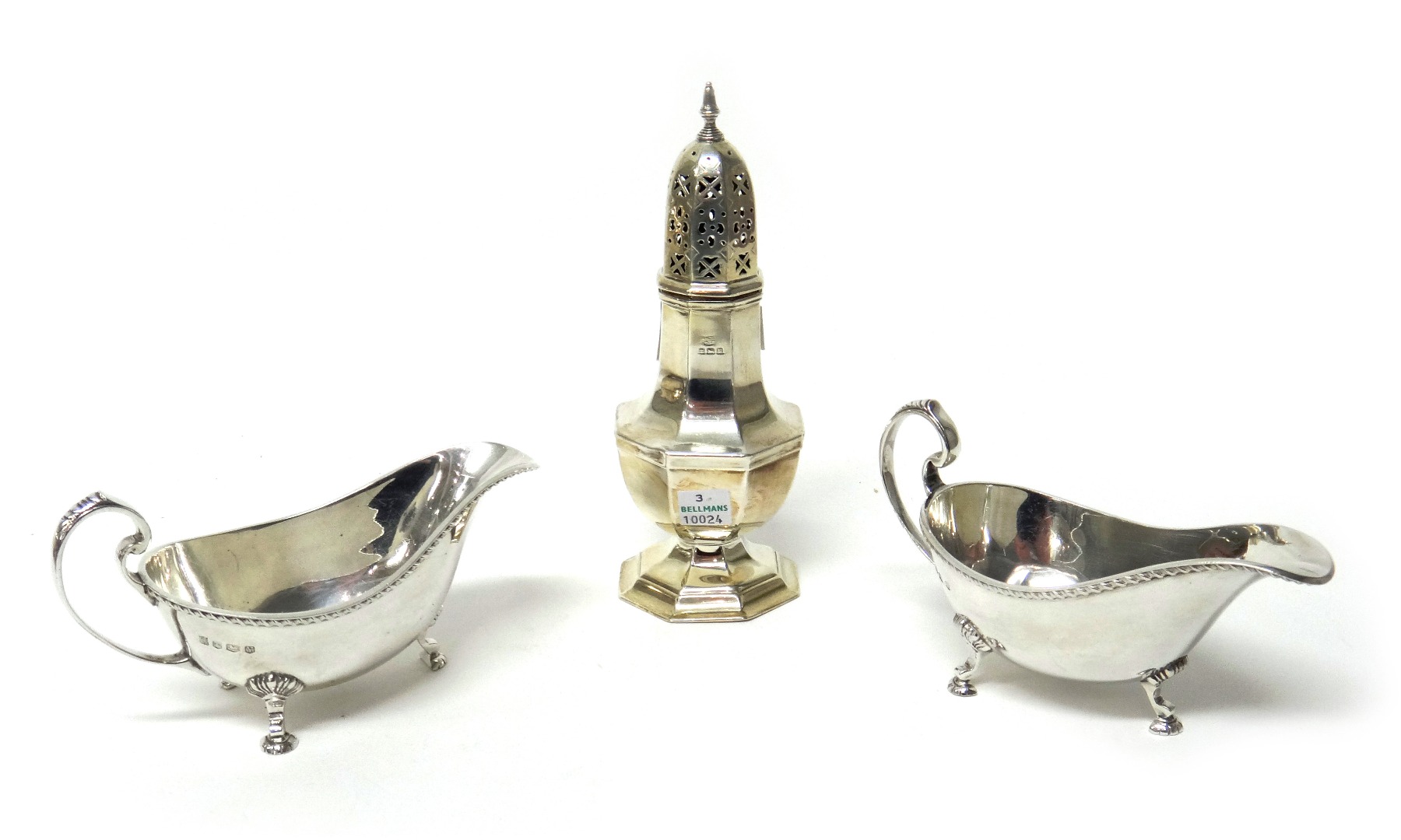 Appraisal: Silver comprising a sugar caster of octagonal baluster form Birmingham