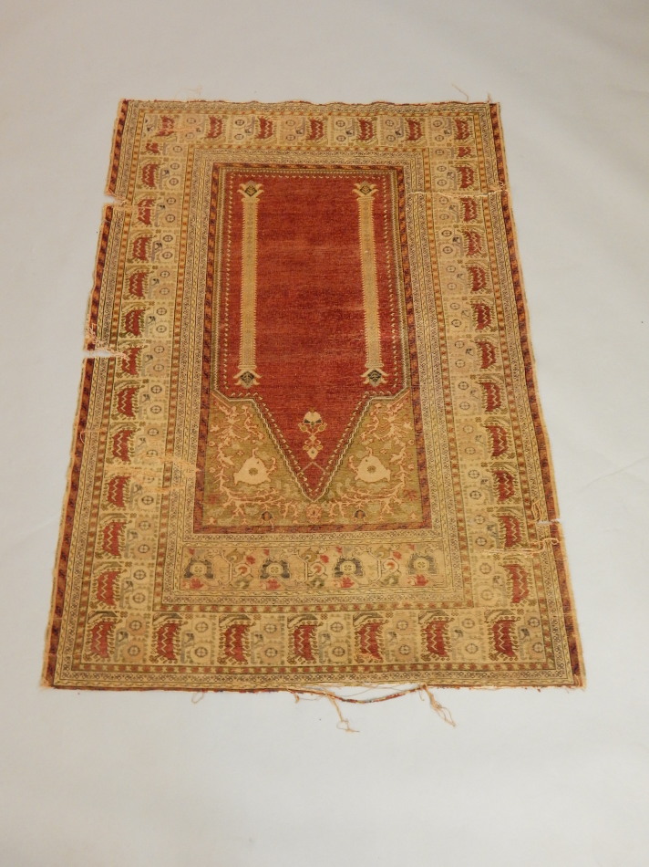 Appraisal: A Persian type prayer rug decorated with twin columns on