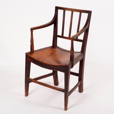 Appraisal: An early th Century oak rail back open armchair with