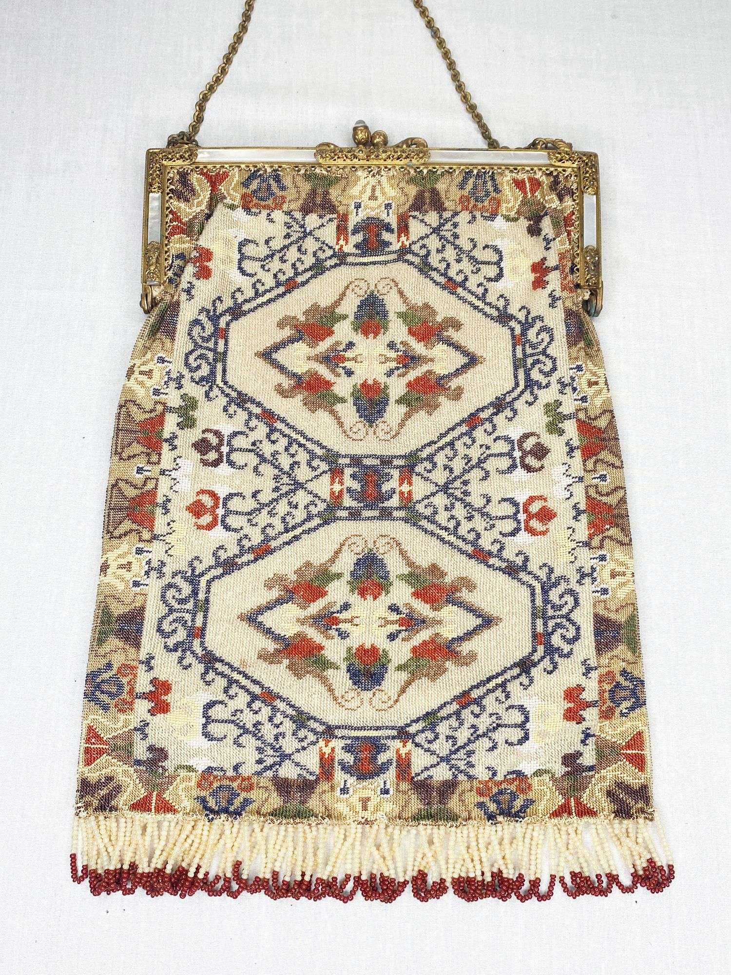 Appraisal: Micro Beaded Carpet Design Hand Bag with MOP inlaid Frame