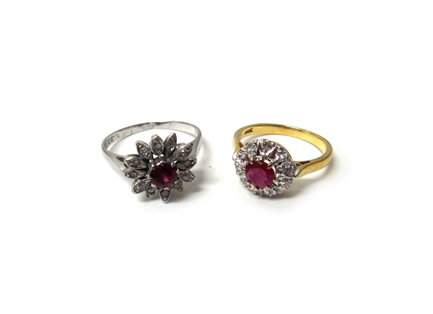 Appraisal: A gold ruby and diamond set cluster ring claw set