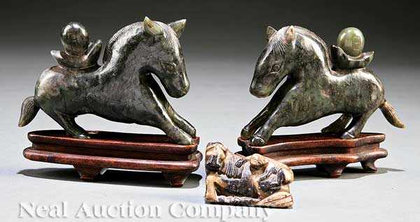 Appraisal: A Pair of Chinese Archaistic Spinach Jade Horses each galloping