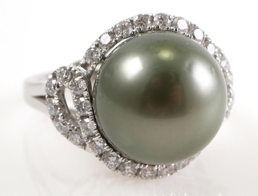 Appraisal: Set in platinum with a mm Tahitian pearl surrounded by