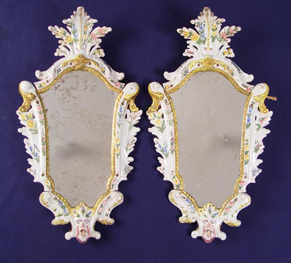 Appraisal: PAIR ITALIAN FAIENCE FRAMED MIRRORS Hand painted faience Original looking