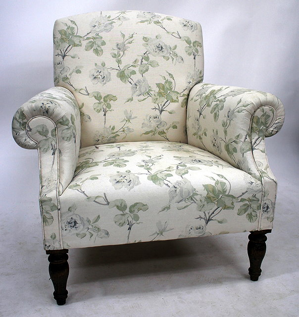 Appraisal: AN OLD FLORAL UPHOLSTERED ARMCHAIR with turned front legs cm