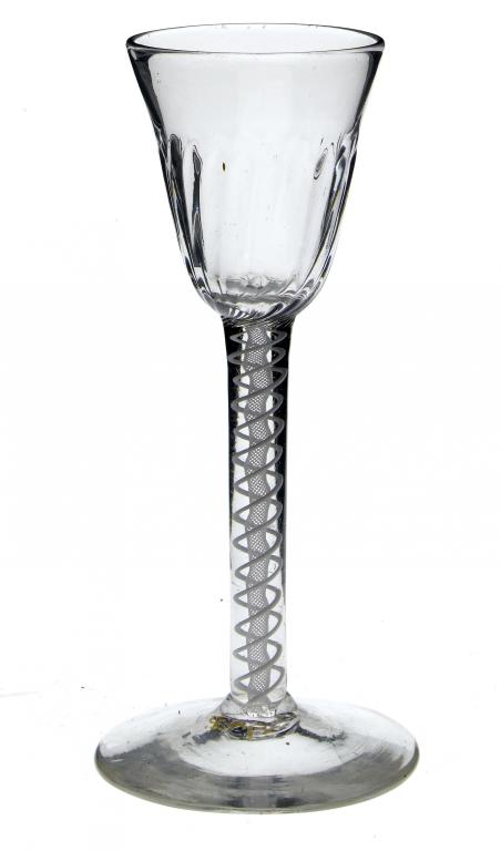 Appraisal: A WINE GLASS the fluted rounded funnel bowl on double