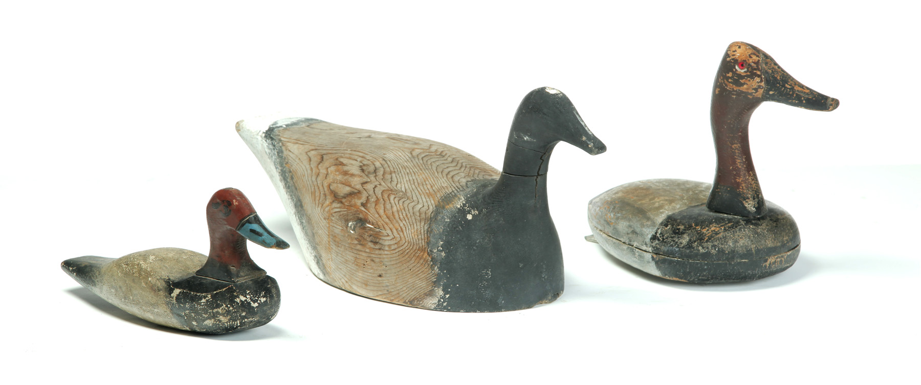 Appraisal: THREE AMERICAN DECOYS Mid th century Primitive decoys with original