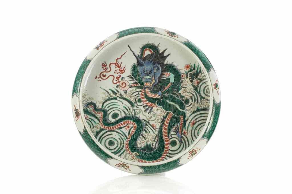 Appraisal: Chinese depicting dragon above waves in a famile verte palette