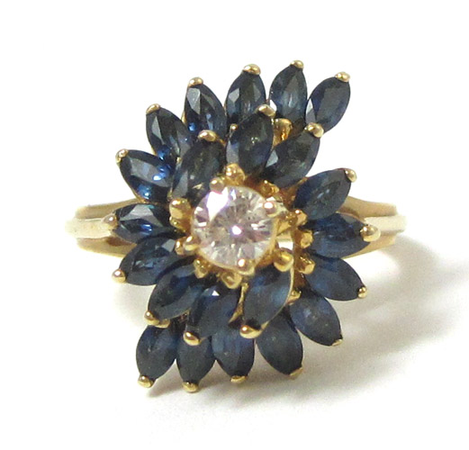 Appraisal: SAPPHIRE DIAMOND AND FOURTEEN KARAT GOLD RING with marquise-cut blue