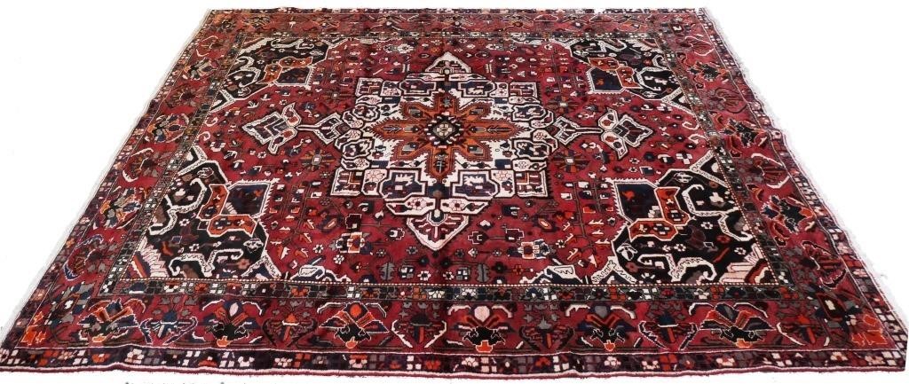 Appraisal: Persian Heriz handwoven wool rug Measures approximately ' x '