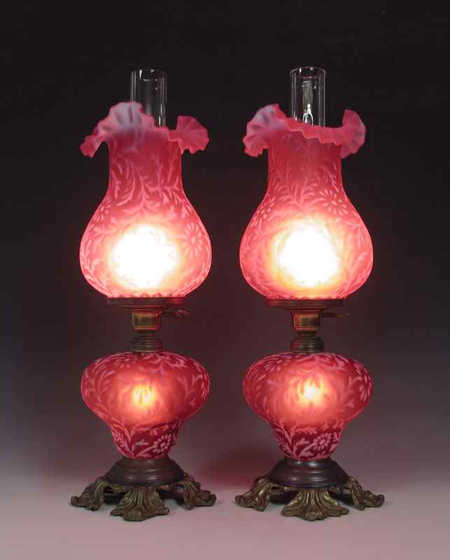 Appraisal: PAIR FENTON CRANBERRY SATIN GLASS DAISY FERN LAMPS '' tall