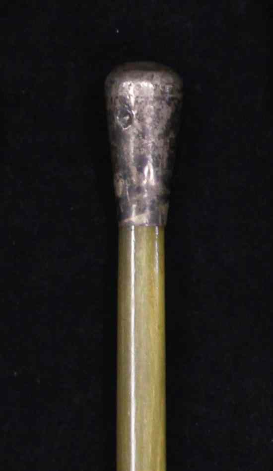 Appraisal: A rhinoceros horn swagger stick c with unmarked white metal