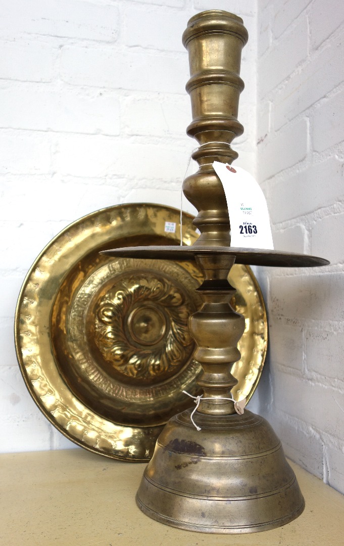 Appraisal: A large Dutch East Indies brass candlestick of turned tapering