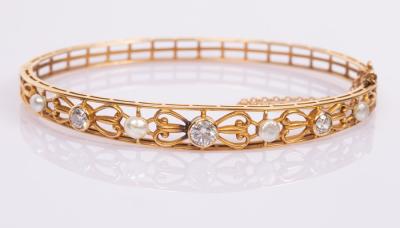 Appraisal: A k yellow gold hinged bangle set with three diamonds