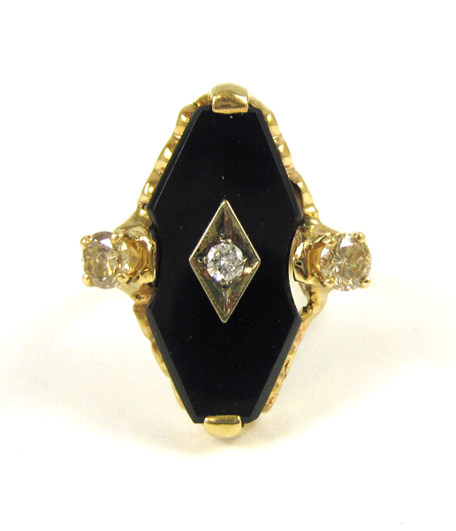 Appraisal: DIAMOND BLACK ONYX AND YELLOW GOLD RING The k gold