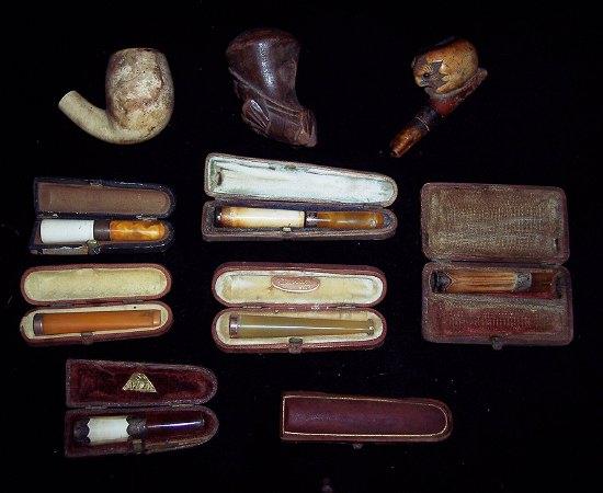 Appraisal: An Aonian ct gold mounted amber cheroot holder five other