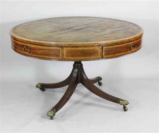 Appraisal: A Regency inlaid mahogany drum top library table with leather