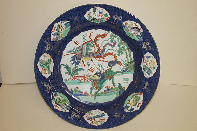 Appraisal: A CHINESE PORCELAIN CHARGER decorated famille verte reserves on powder