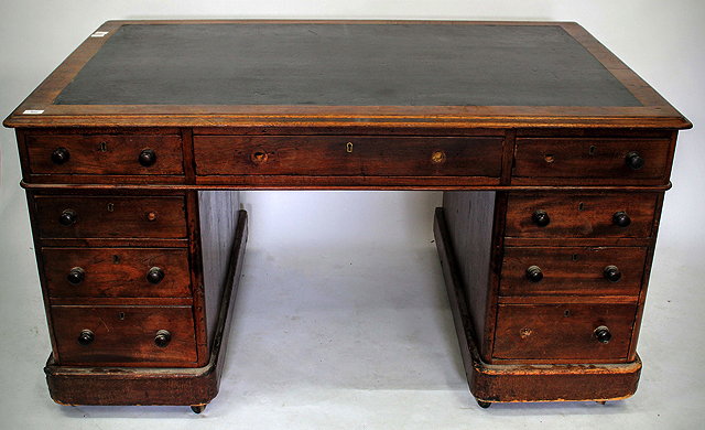 Appraisal: A VICTORIAN MAHOGANY PEDESTAL DESK with a black leather or