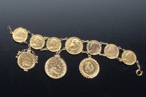 Appraisal: Gold coin bracelet of seven coins three numismatically mounted Liberty