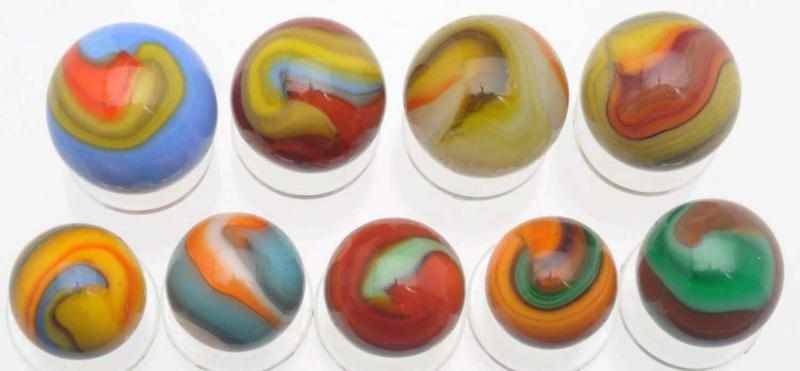 Appraisal: Lot of Akro Multi-Colored Corkscrew Marbles Some of these corkscrews