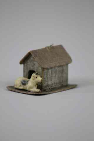 Appraisal: DRESDEN DOG AND DOGHOUSE ORNAMENT Germany white dog with spots