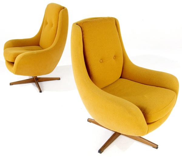 Appraisal: SCANDINAVIAN Pair of armchairs upholstered ochre fabric on swivel bases