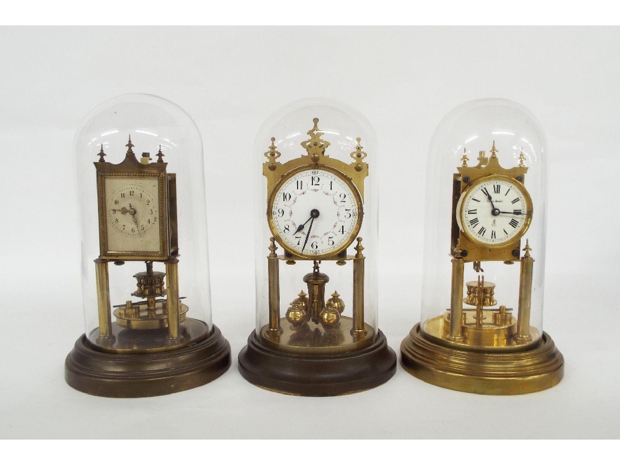 Appraisal: Three different style Gustav Becker torsion mantel clocks under glass