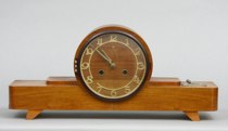 Appraisal: Art Deco Wooden Mantle Clock with Key This wooden cased