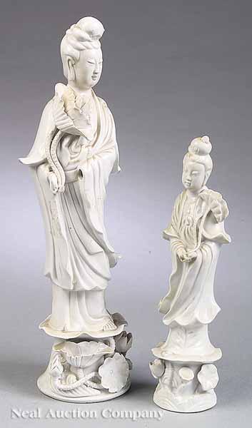 Appraisal: Two Blanc de Chine Figures of Guanyin both carrying lotus