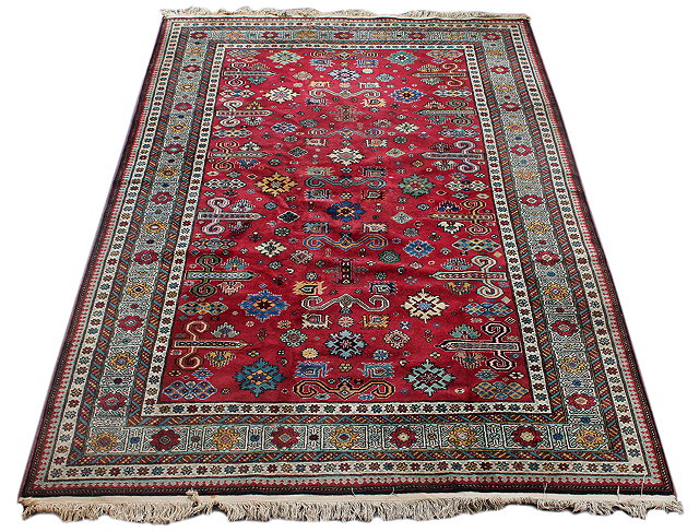 Appraisal: A MIDDLE EASTERN KAZAK AUBERGINE GROUND SMALL CARPET with a