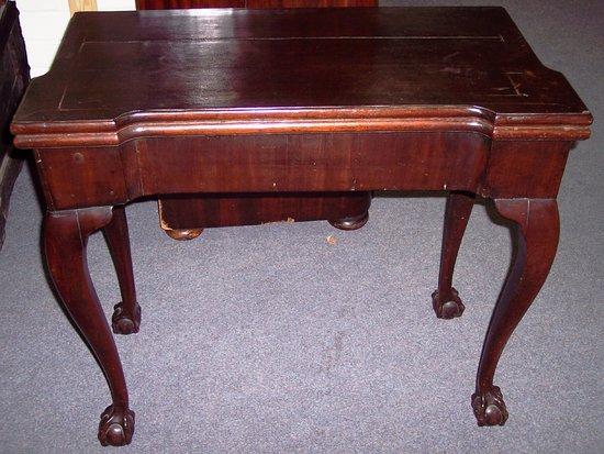 Appraisal: An th Century style mahogany foldover card table with baize