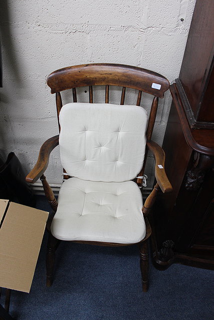 Appraisal: A TH CENTURY SPINDLE BACK WINDSOR ARMCHAIR with turned supports