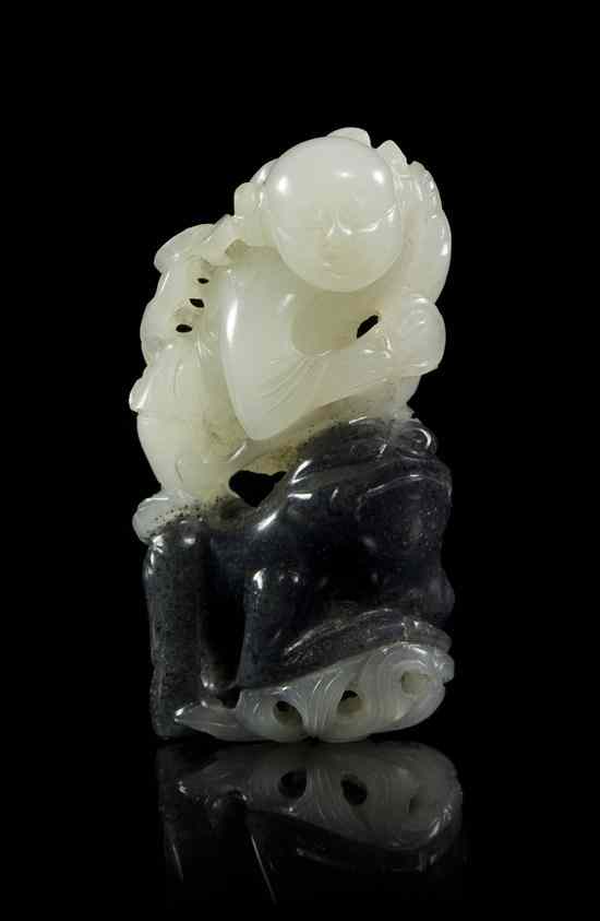 Appraisal: A Black White and Celadon Colored Jade Toggle depicting Liuhai