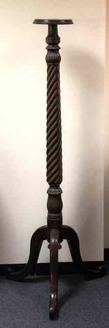 Appraisal: A Regency mahogany torch re with reeded spiral column and