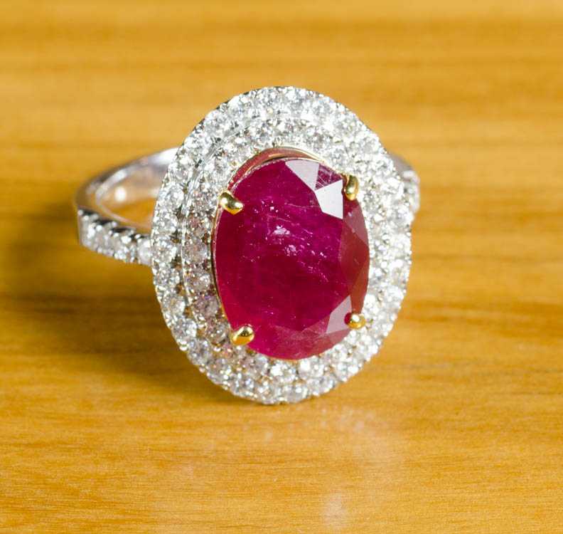 Appraisal: RUBY DIAMOND AND FOURTEEN KARAT GOLD RING The white and