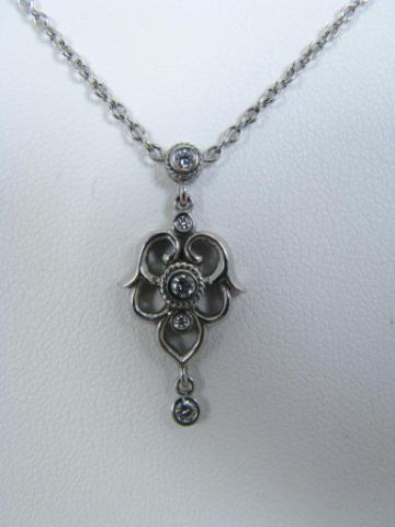 Appraisal: New k white gold scroll design diamond drop necklace by