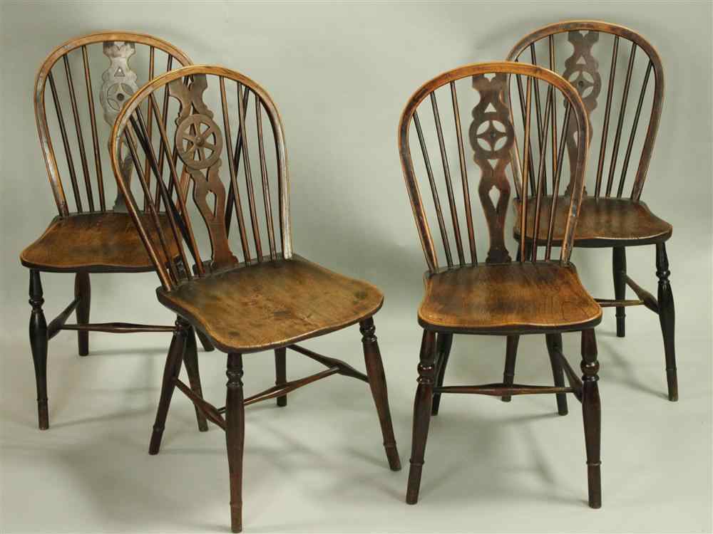 Appraisal: FOUR ENGLISH ASH AND ELM WHEEL-BACK WINDSOR CHAIRS mid th