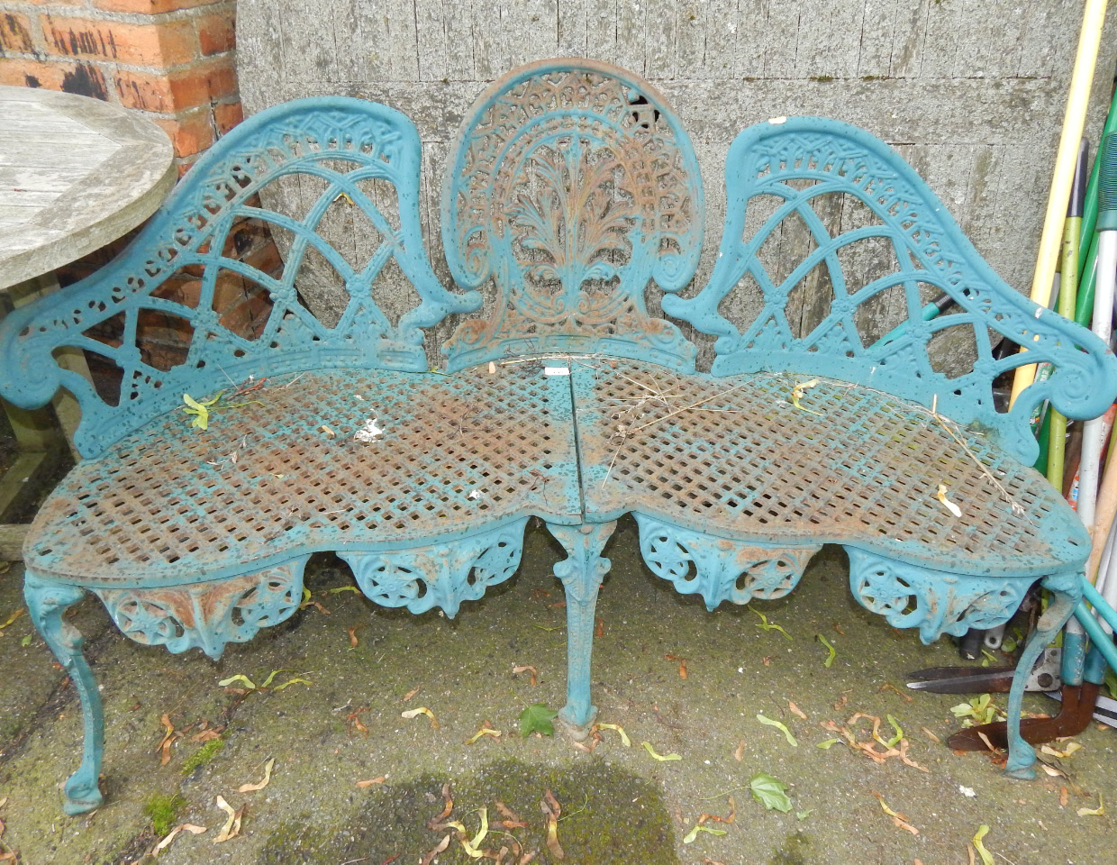 Appraisal: A Coalbrookdale style turquoise Romanesque style cast iron three seater