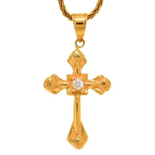 Appraisal: A ct gold cross set with a white sapphire mm