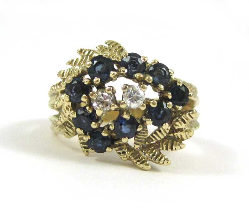 Appraisal: SAPPHIRE DIAMOND AND FOURTEEN KARAT GOLD RING set with nine