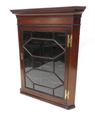 Appraisal: A thC mahogany hanging corner cupboard the moulded dentil cornice